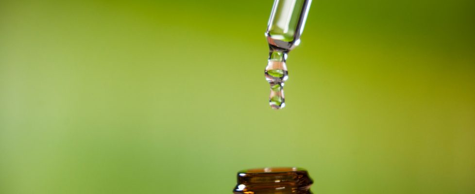 drop-oil-dripping-from-pipette-into-bottle-essential-oil(1)